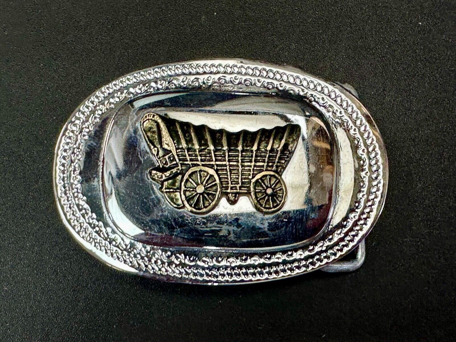 70s Covered Wagon two tone reflective oval ornate boarder belt buckle