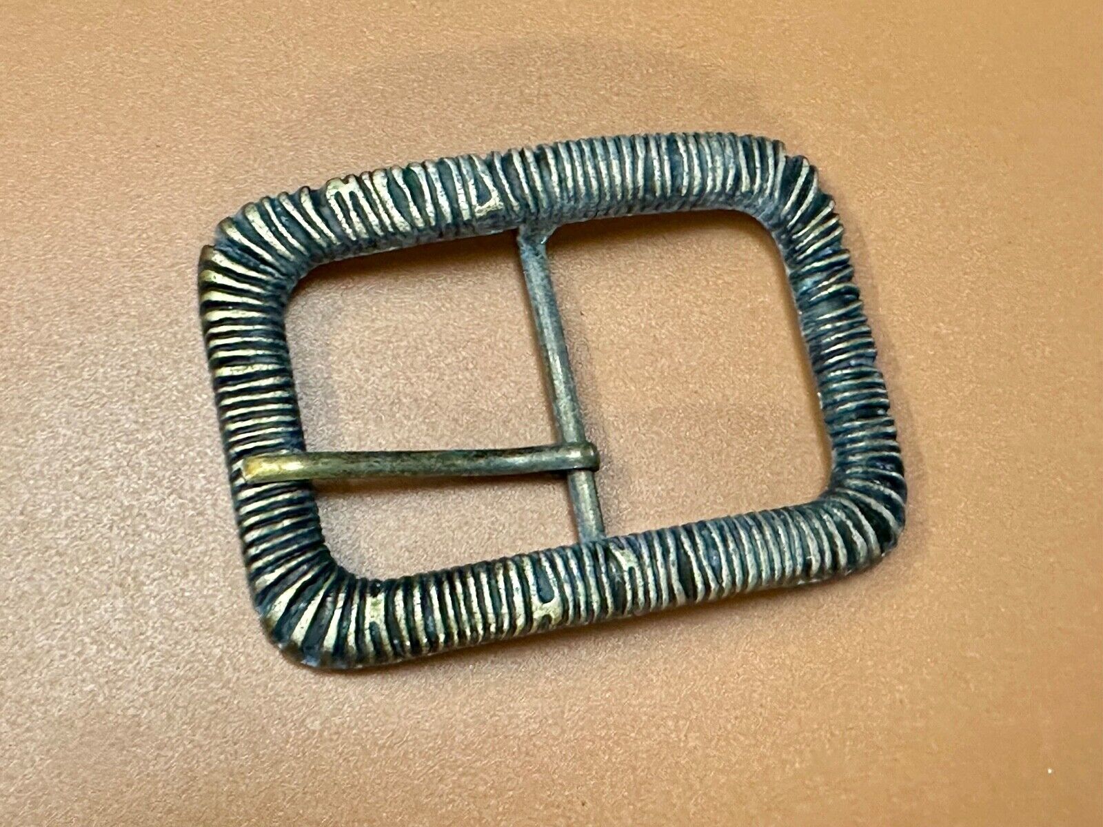Unique Center Bar Spring abstracted wrapped style rectangular belt buckle