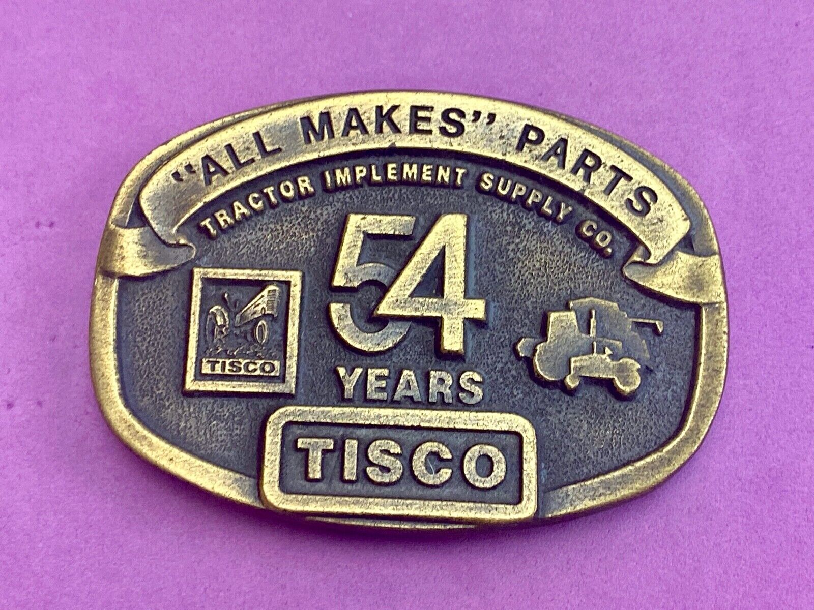 54 years Tisco Tractor Implement Supply Spec Cast Brass Belt Buckle series 2