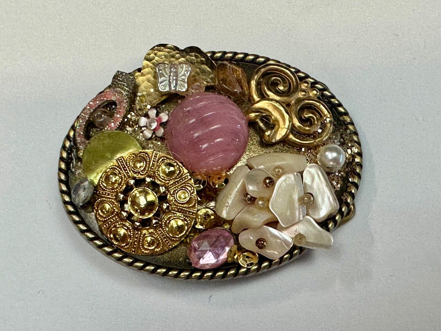 Artisan Abstract flowers made of mixed material on gold tone oval belt buckle