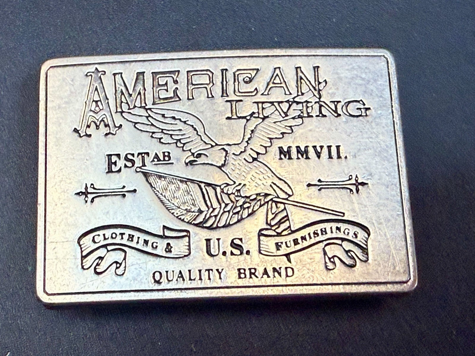 American Living Clothing & Furnishing U.S Quality Brand Promo Belt Buckle