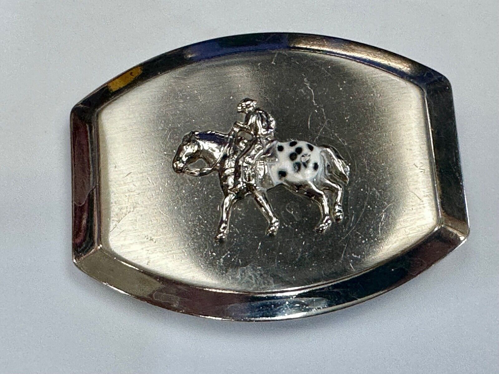 Vintage Horseback Riders cowboys belt buckle with black & white enamel accents