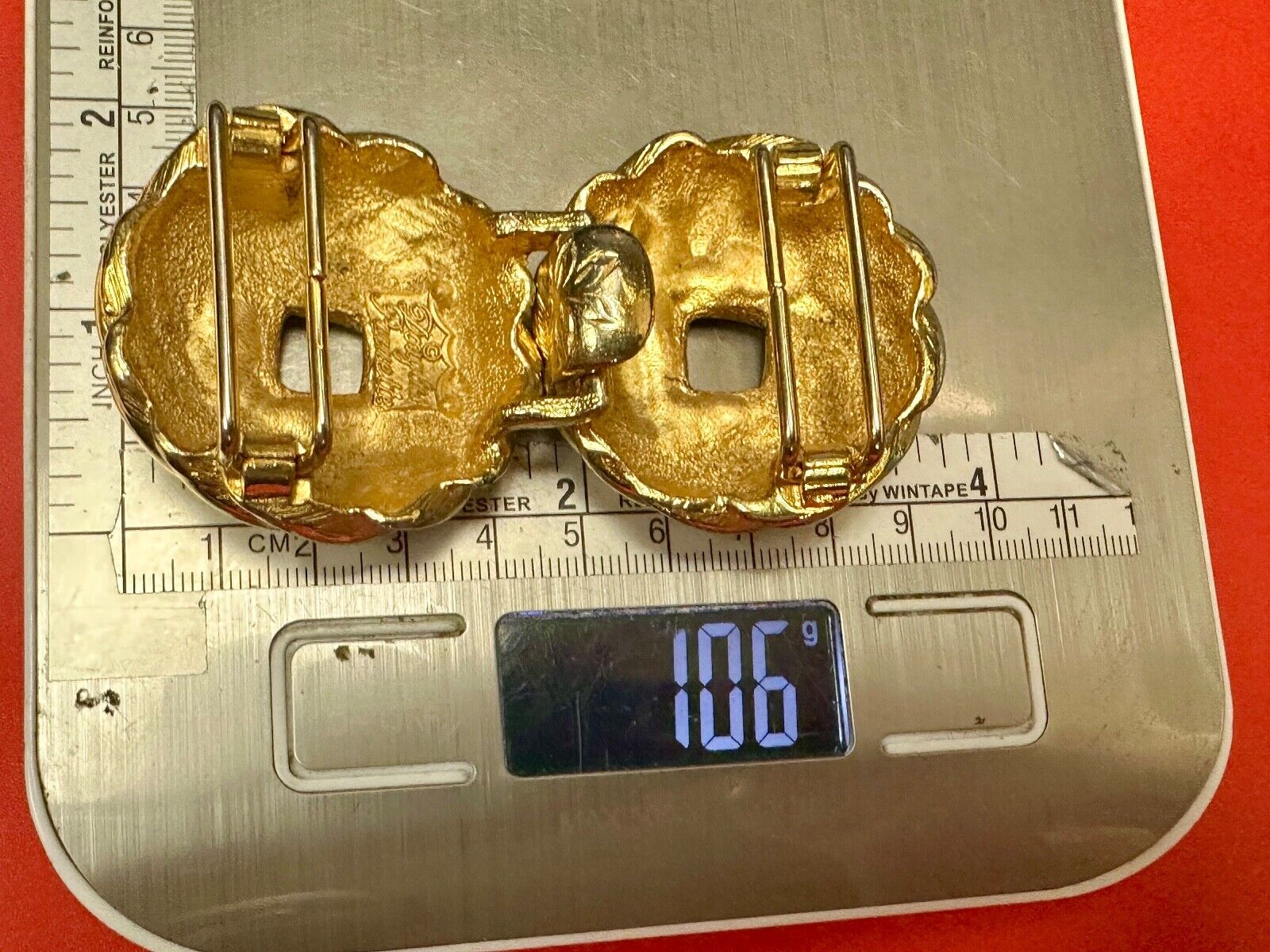 Two piece Round Swirl Interlocking gold color belt buckle by Douglas Paquette