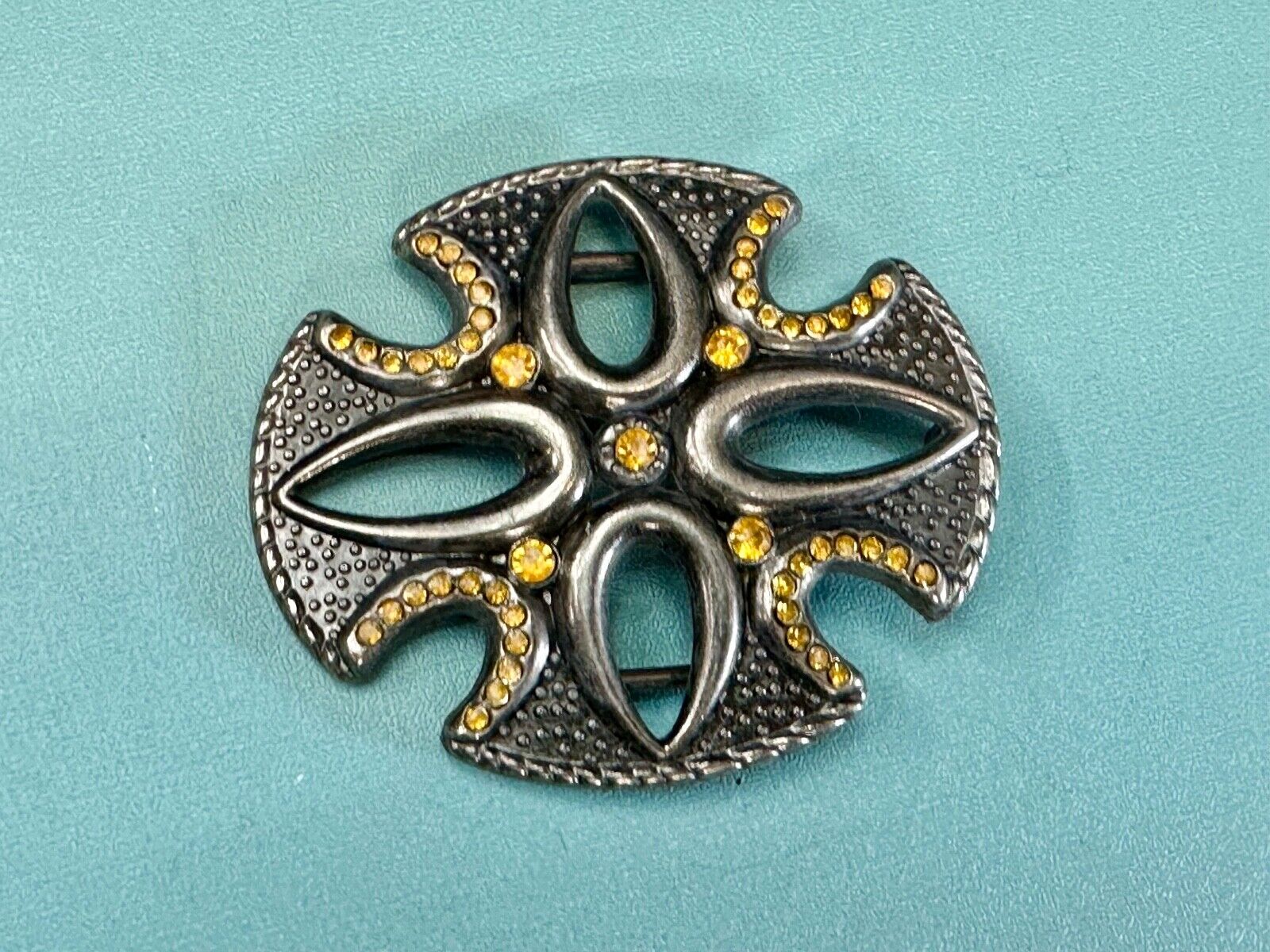 unique see through iron cross with golden brown rhinestone accents