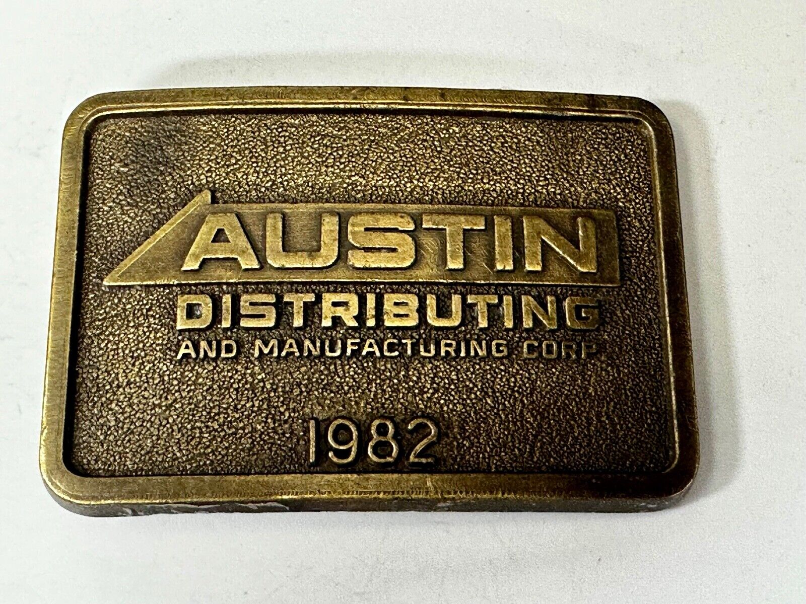 Austin Texas Distributing and Manufacturing 1982 Advertisement Promo Belt Buckle