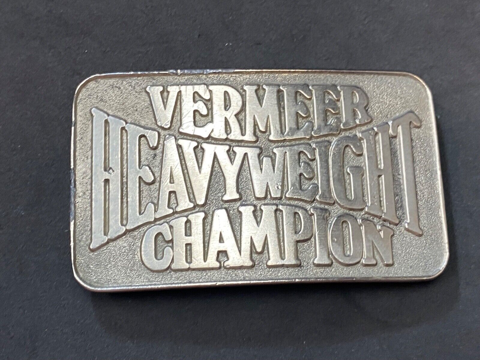 Vermeer Heavyweight Champion Belt Buckle by Spec Cast