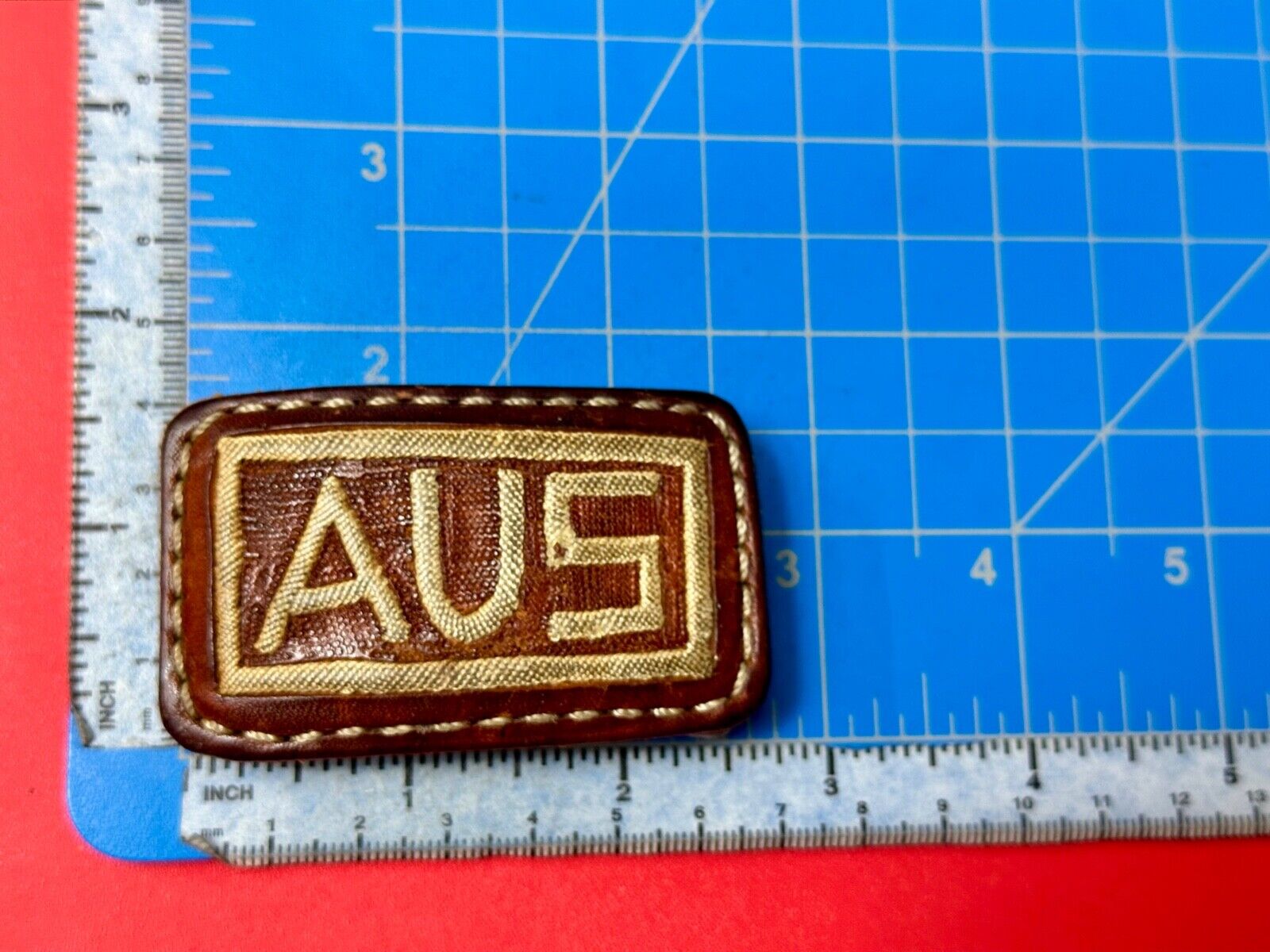 AUS  Brown leather with cream color Stitching  pre loved belt buckle