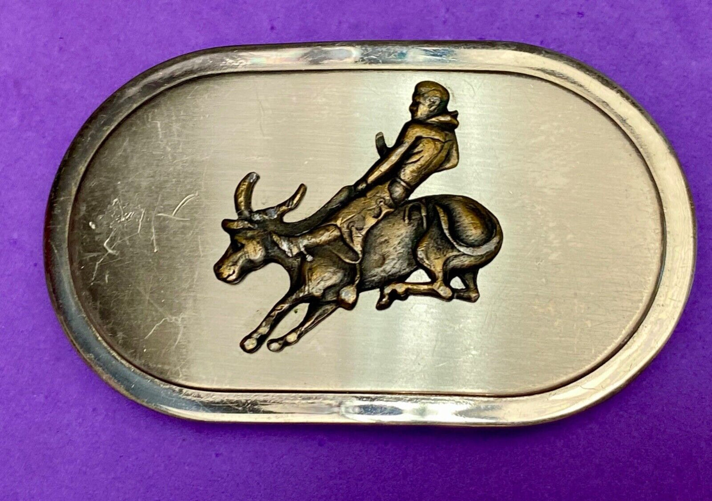 Vintage western oval Rodeo Cowboy on bucking bronc? bull numbered belt buckle