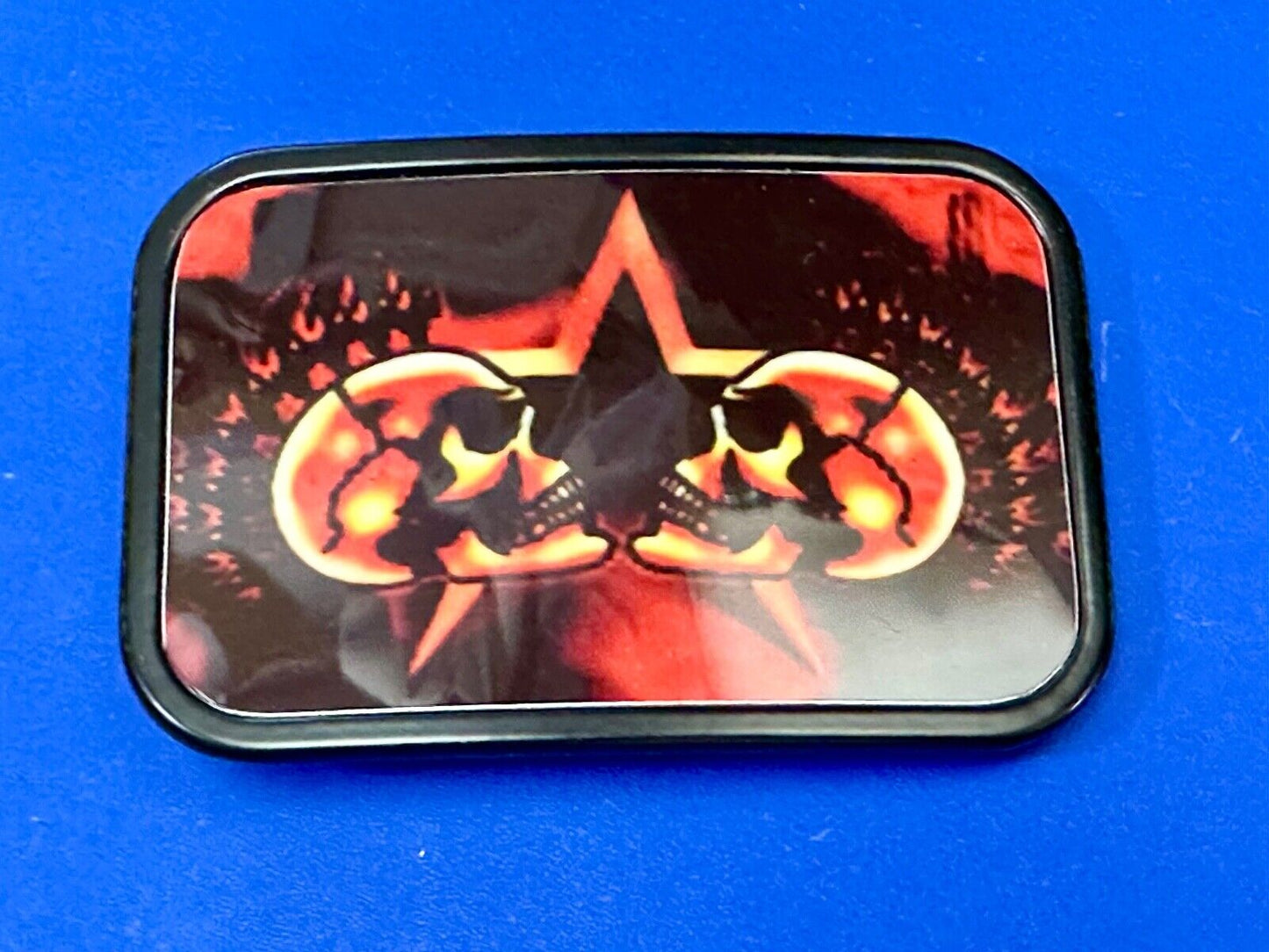 Two Skulls around star picture - black & red color rectangular belt buckle