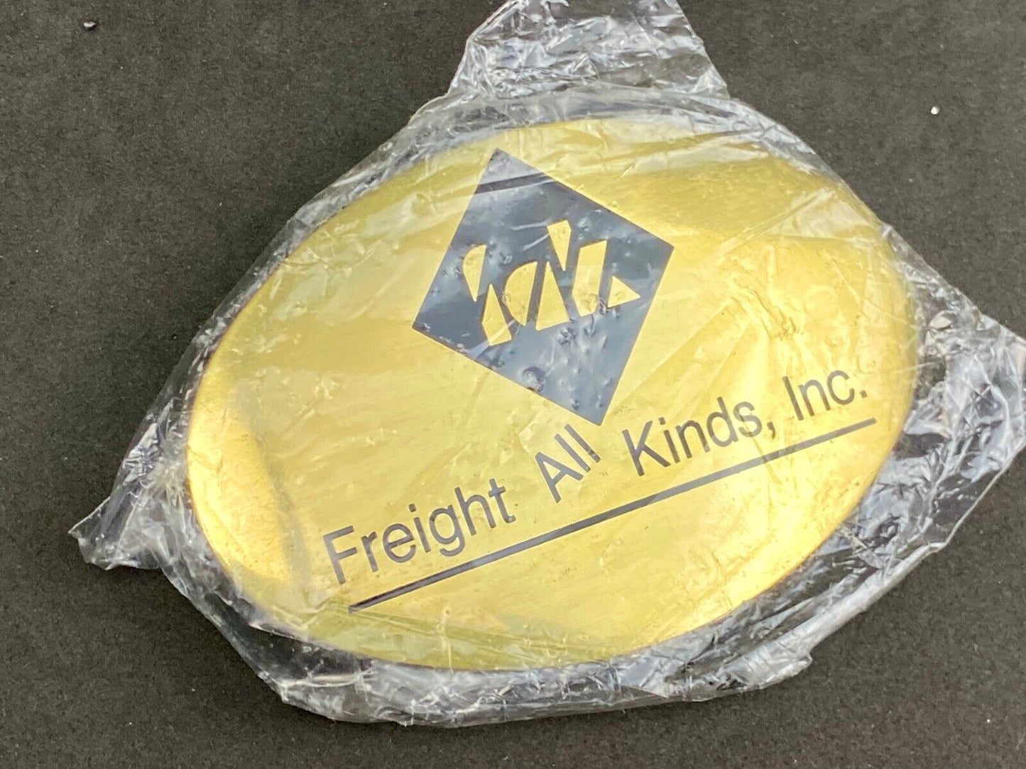 Vintage Freight all kinds, INC. promotional brass belt buckle 
