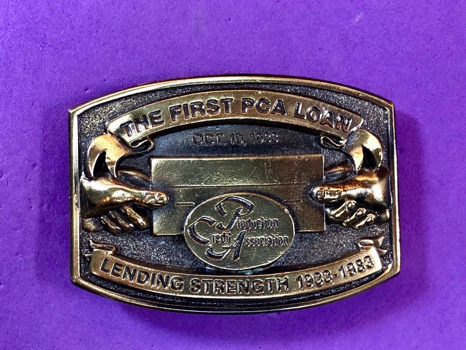 The first PCA loan belt buckle - Lending and strength  production credit assn.