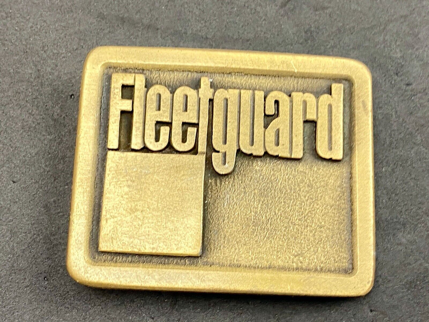 Vintage Fleetguard Construction Equipment Company Advertising Belt Buckle 