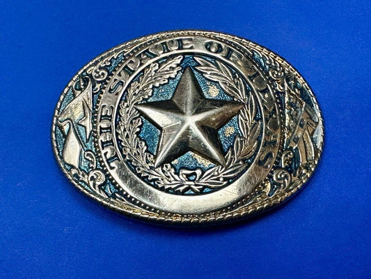 The Great State of Texas - gold color star belt buckle with blue colored accents