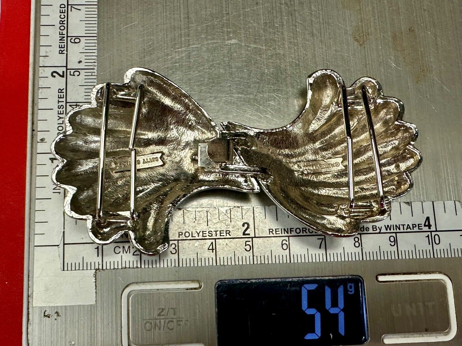 Two-piece interlocking gold color belt buckle by Dotty Smith