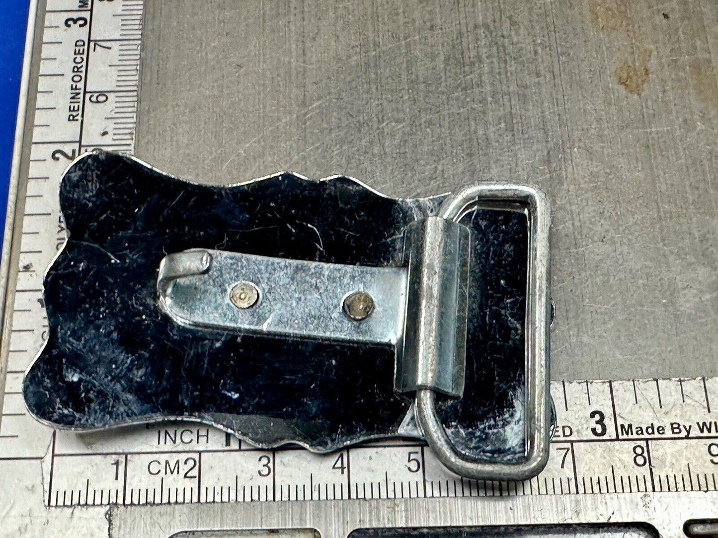 Vintage horse head through lucky horseshoe on reflective western belt buckle