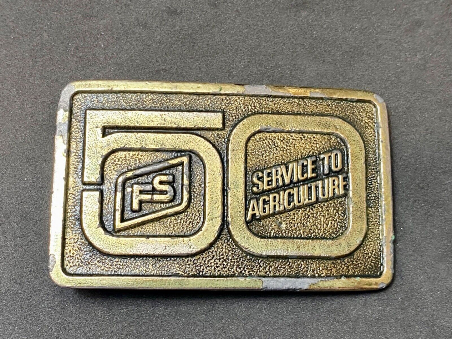 50 years, Farm Service to Agriculture belt buckle by Wyoming Studio Art works