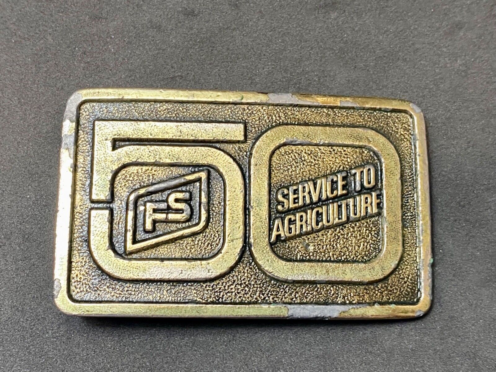 50 years, Farm Service to Agriculture belt buckle by Wyoming Studio Art works
