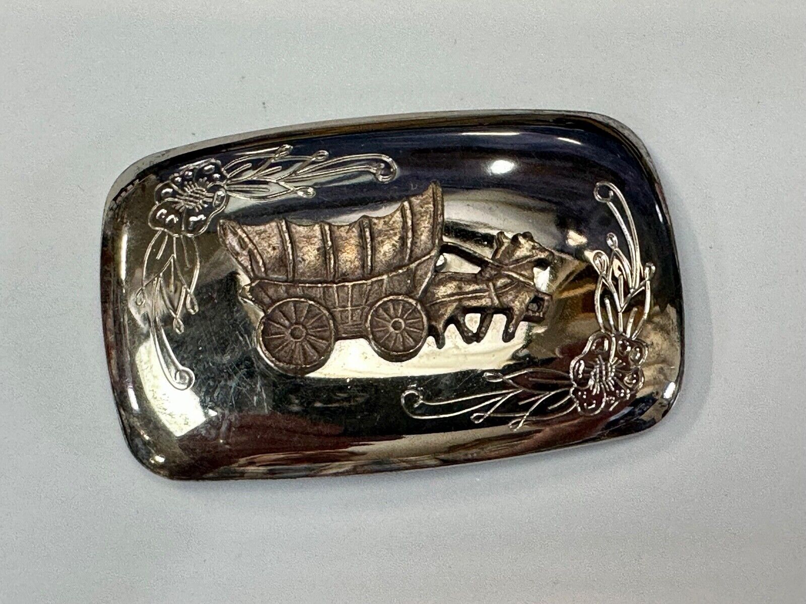 Vintage Horse Drawn Covered wagon on reflective western two tone belt buckle