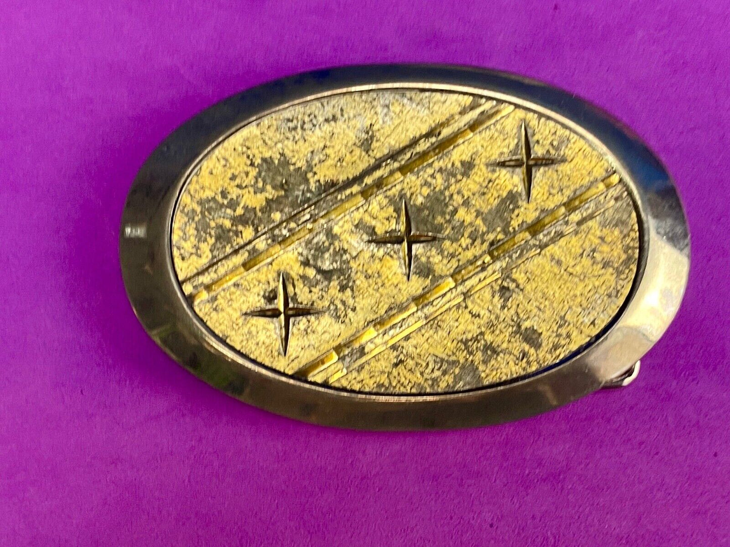 Unique XXX gold tone belt buckle tic tac toe pattern