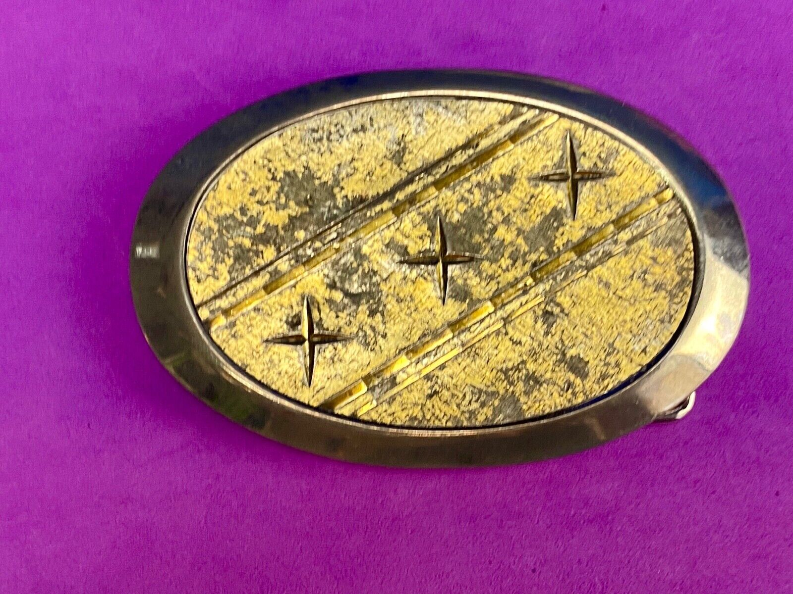Unique XXX gold tone belt buckle tic tac toe pattern