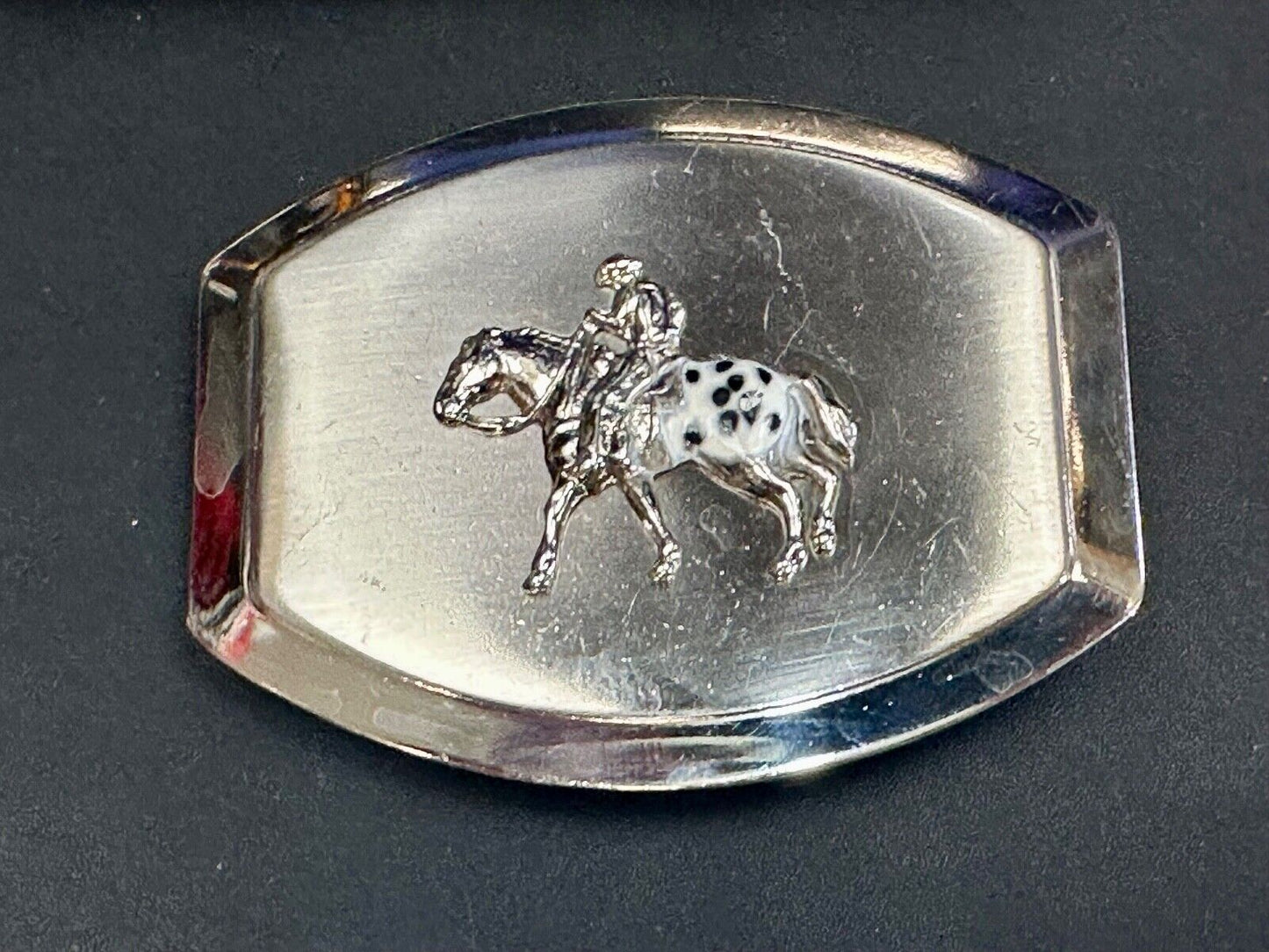 Vintage Horseback Riders cowboys belt buckle with black & white enamel accents
