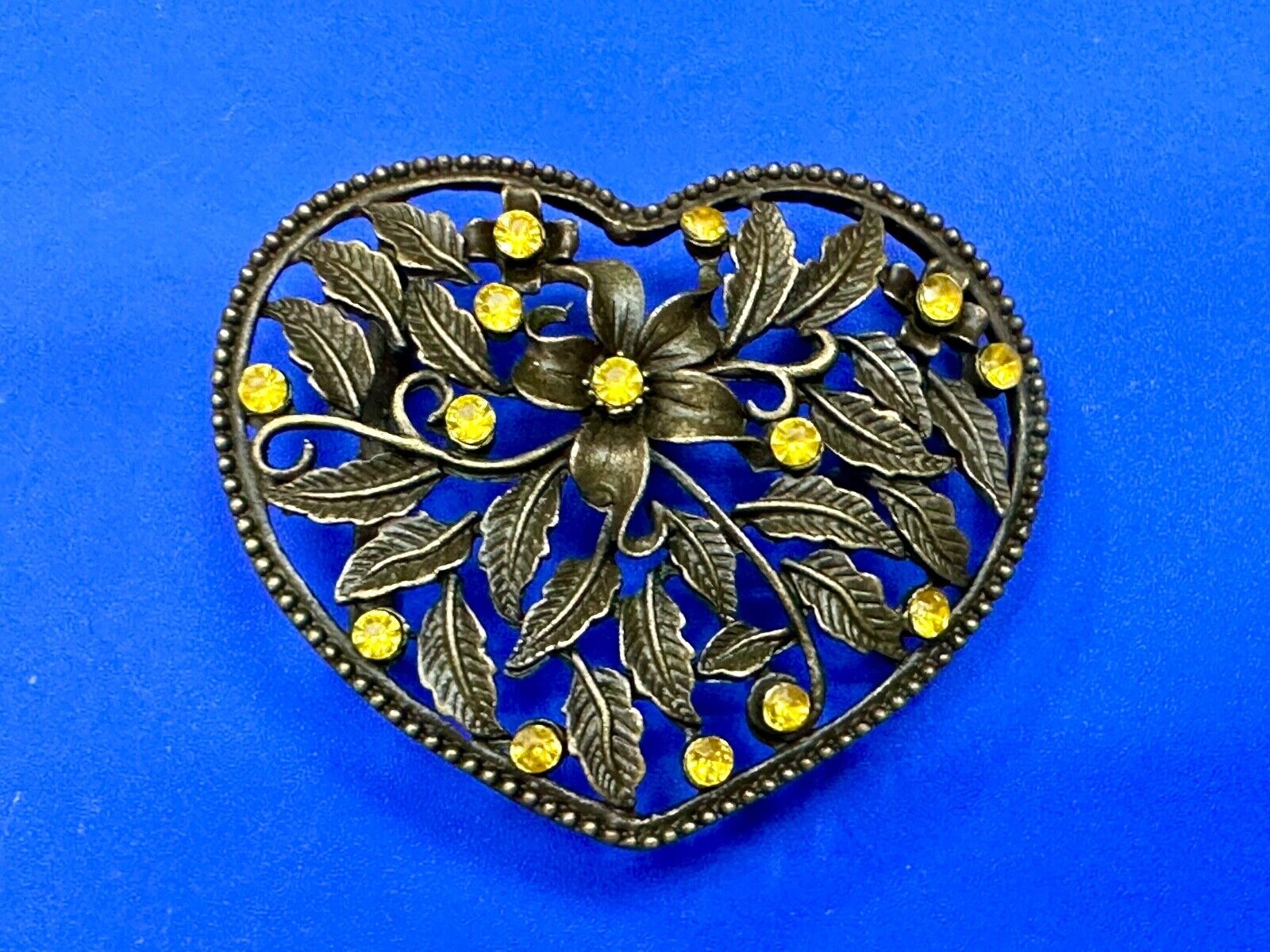 Beautiful see through Heart shaped belt buckle with yellow rhinestone accents