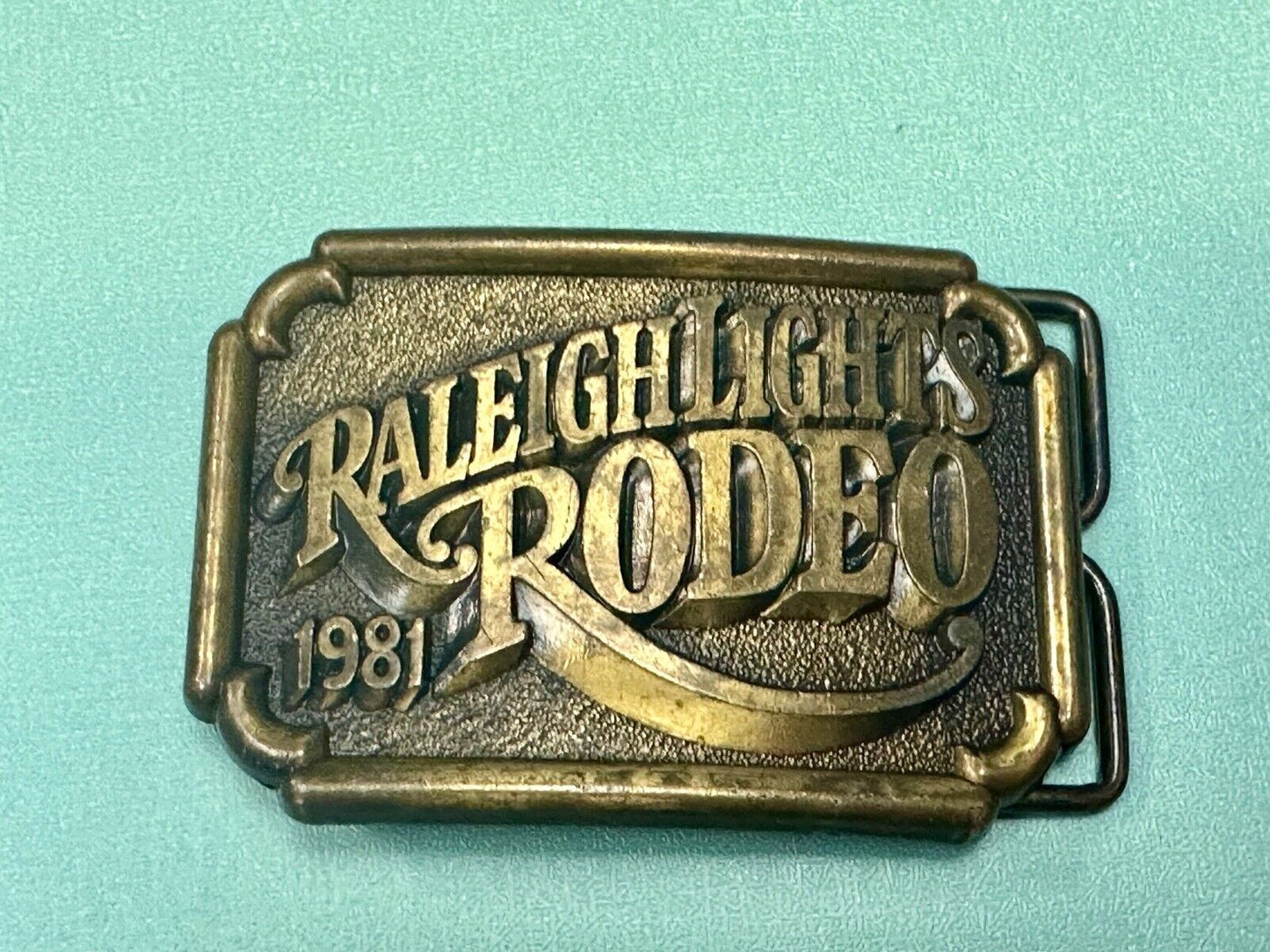 Vintage 1981 Raleigh Lights Rodeo Brass Tone Belt Buckle Advertising Cigarettes