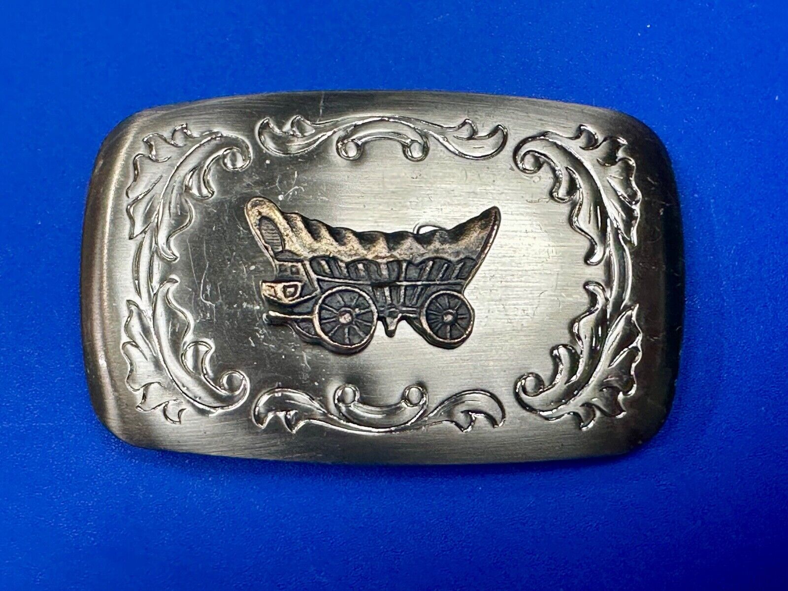 Vintage covered wagon two tone western mixed metal belt buckle