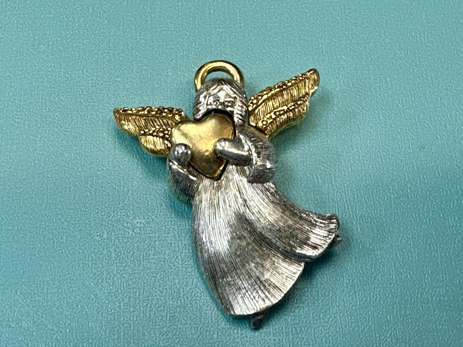 Angle holding heart -vintage two tone LC Liz Claiborne Signed Brooch Pin
