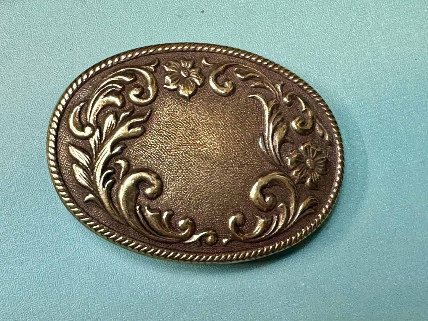 USA made vintage western flower swirl design oval belt buckle marked W