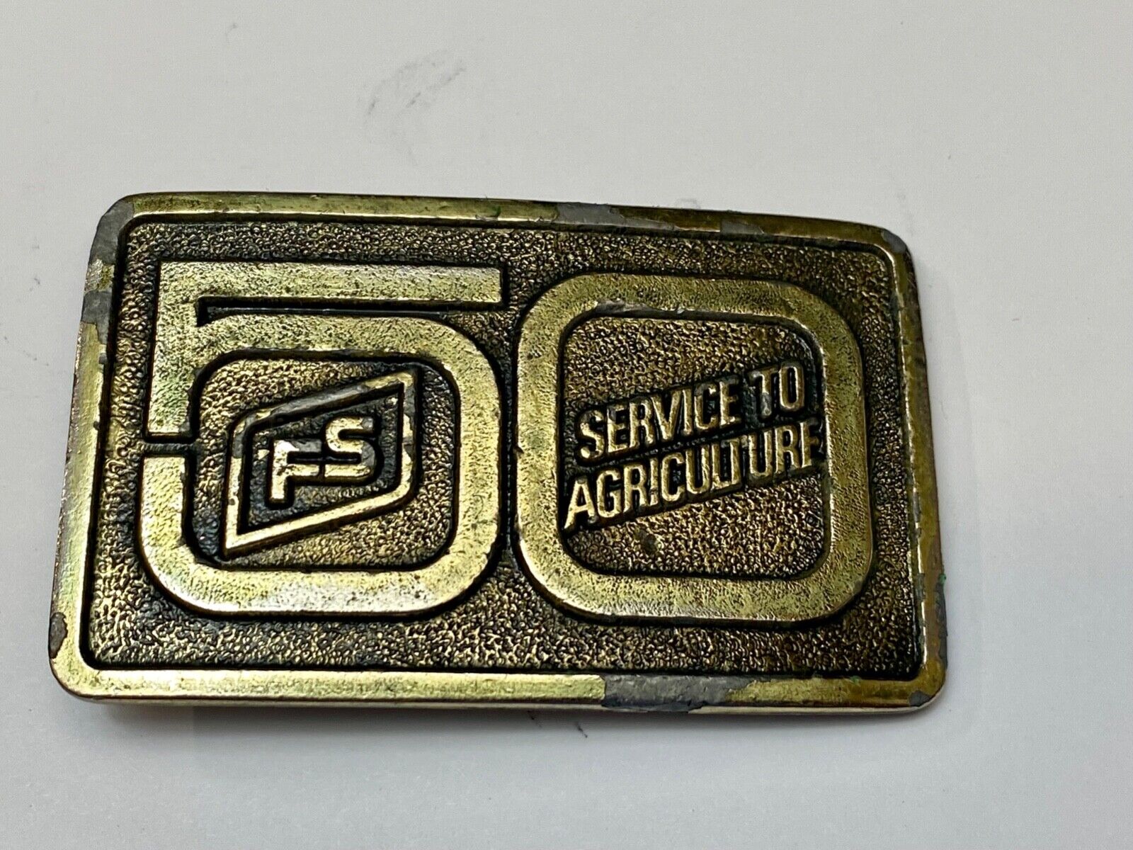 50 years, Farm Service to Agriculture belt buckle by Wyoming Studio Art works