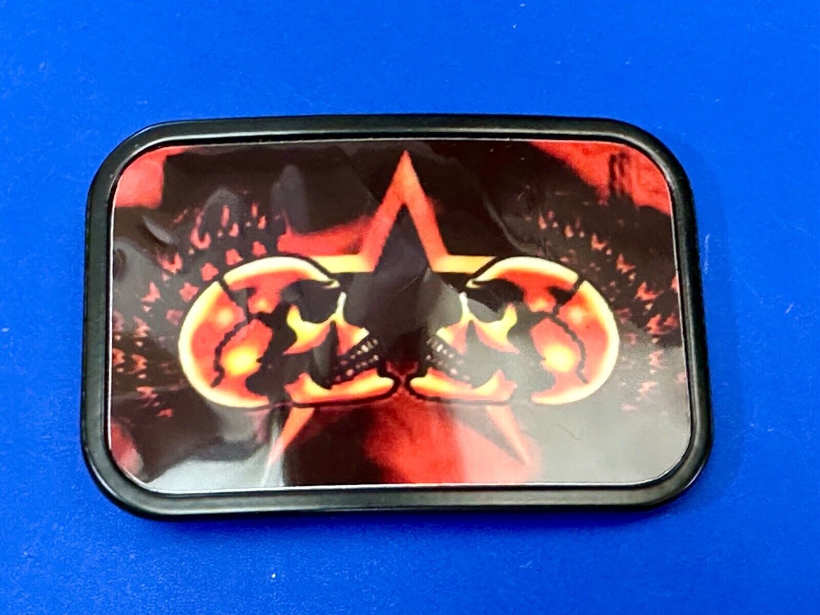 Two Skulls around star picture - black & red color rectangular belt buckle