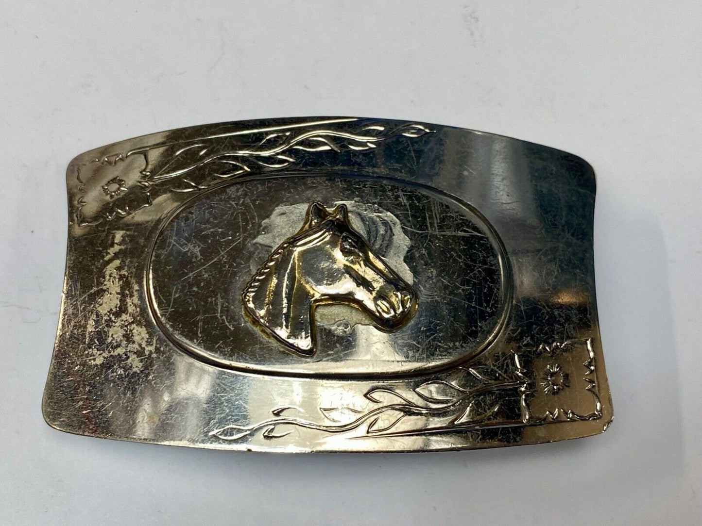 Vintage horse head on western belt buckle