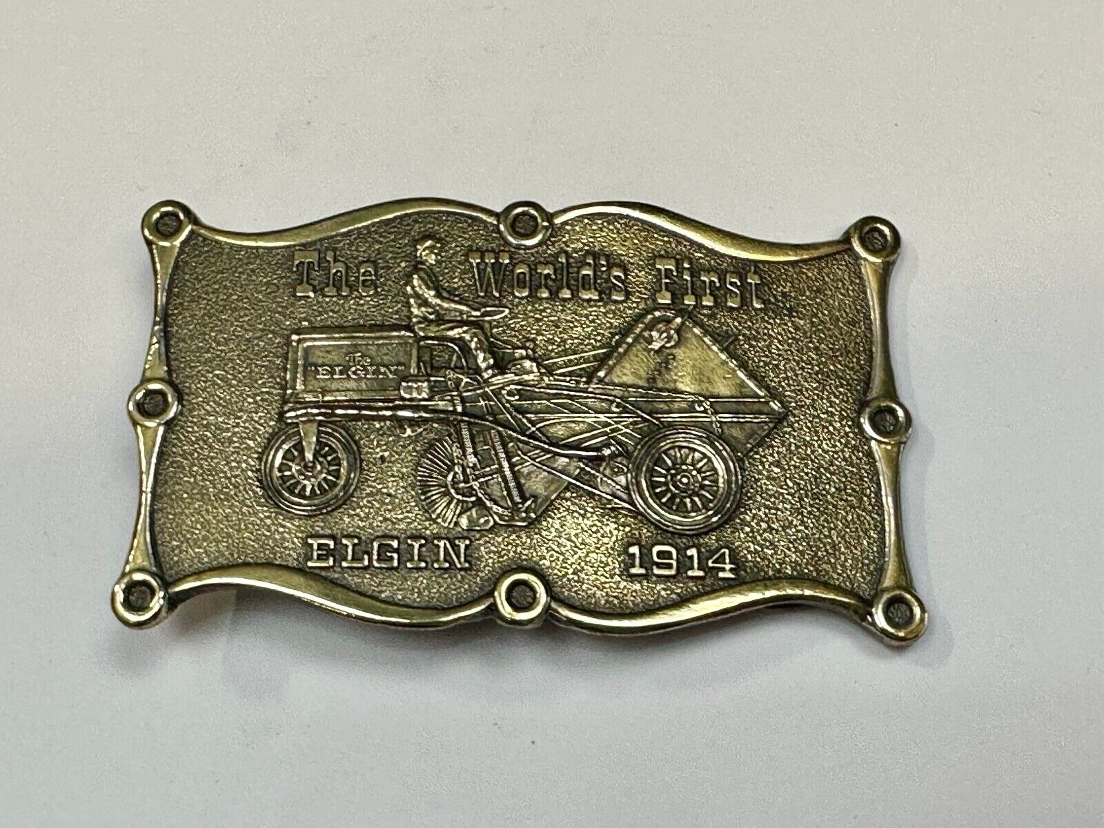 The Elgin, The worlds first tree sweeper commemorative belt buckle by Lewis