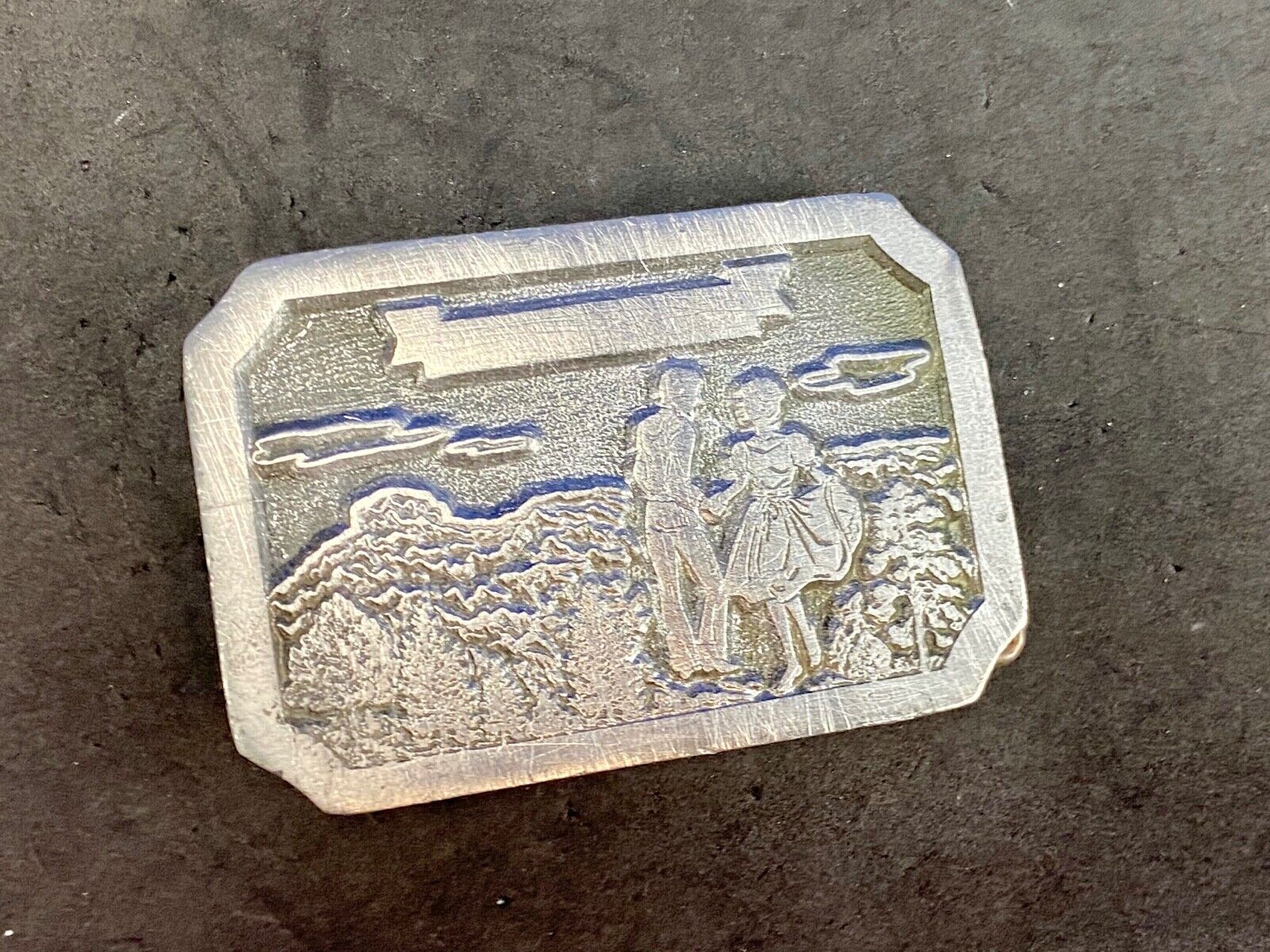 Vintage daleco belt buckle featuring a dancing couple 