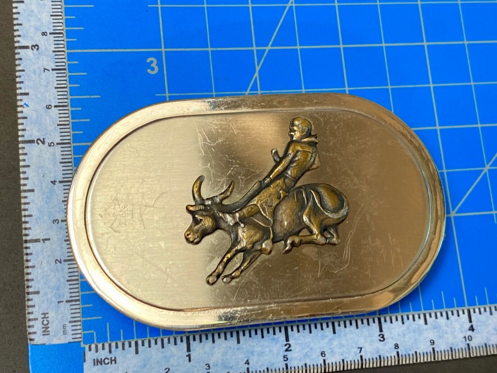 Vintage western oval Rodeo Cowboy on bucking bronc? bull numbered belt buckle