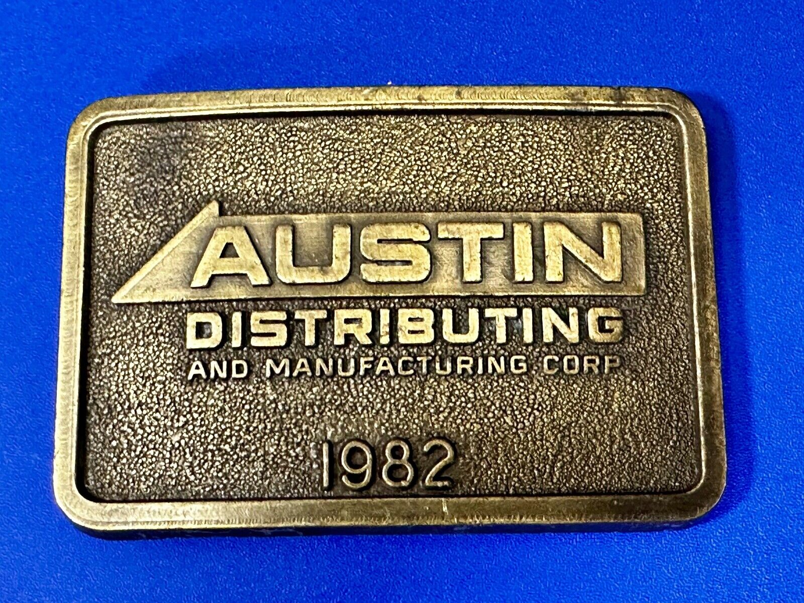 Austin Texas Distributing and Manufacturing 1982 Advertisement Promo Belt Buckle