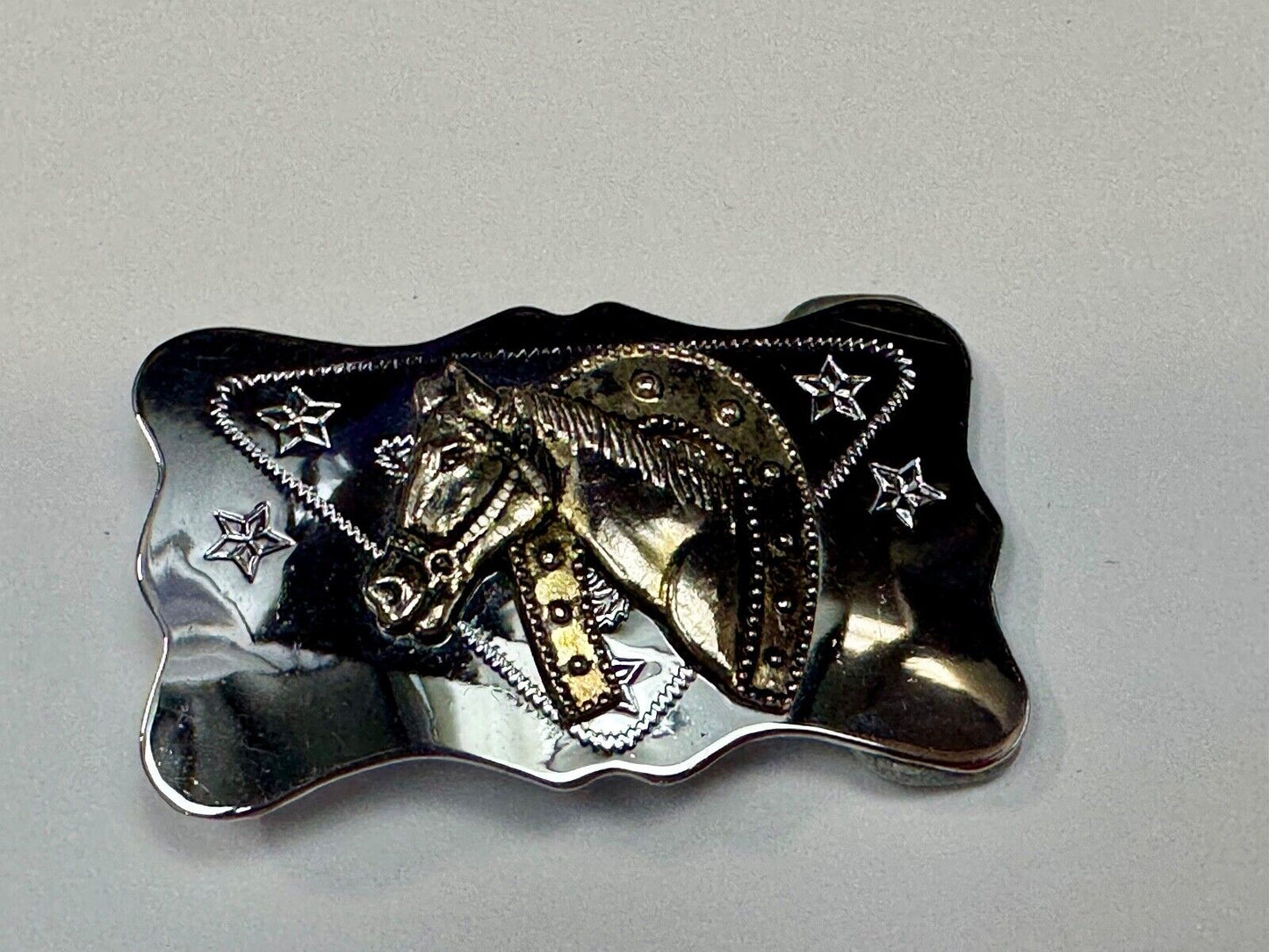 Vintage horse head through lucky horseshoe on reflective western belt buckle