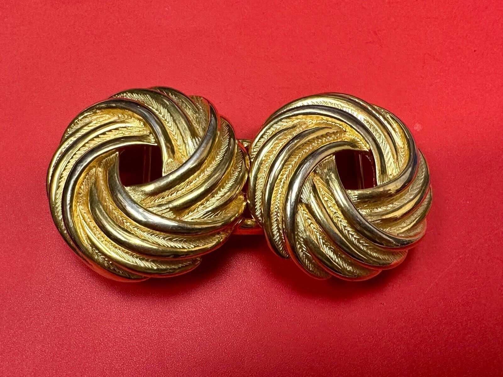 Two piece Round Swirl Interlocking gold color belt buckle by Douglas Paquette