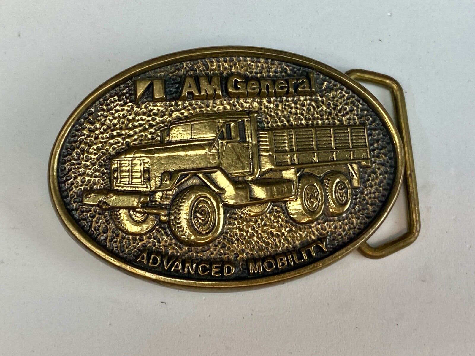 AM General Advanced Mobility belt buckle 2nd in a collector series 5 Ton Trucks 