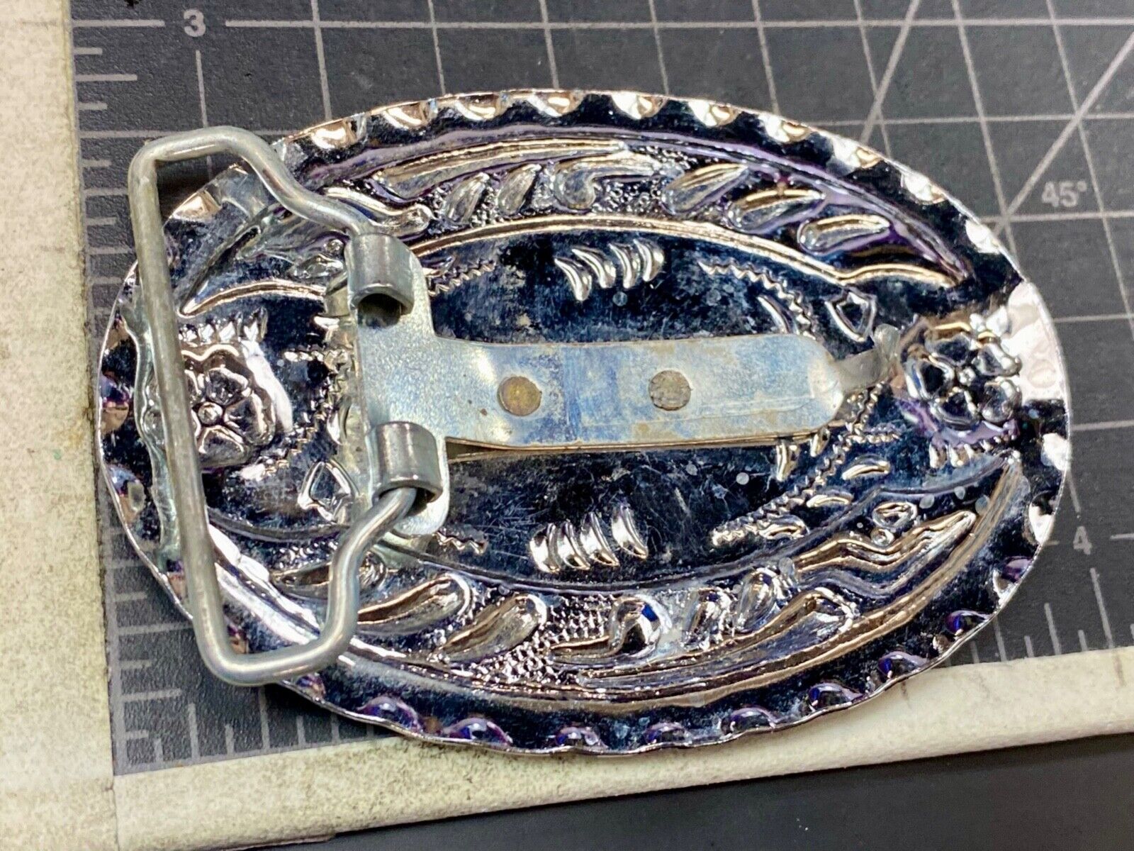 Vintage horse head through lucky horseshoe on mixed metal western belt buckle
