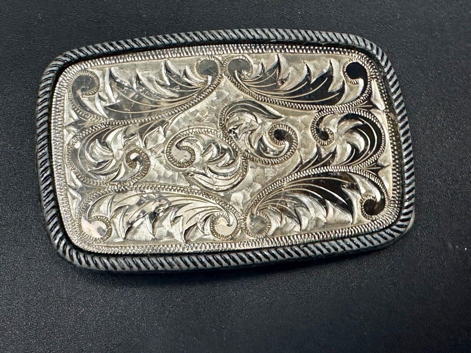 Vintage flower theme etched oval western belt buckle W/ rope border