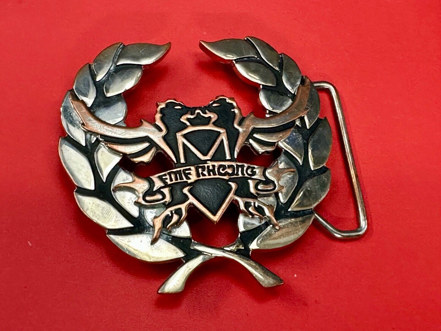 Two griffins?  FME RheJNG Olive branch cutout belt buckle
