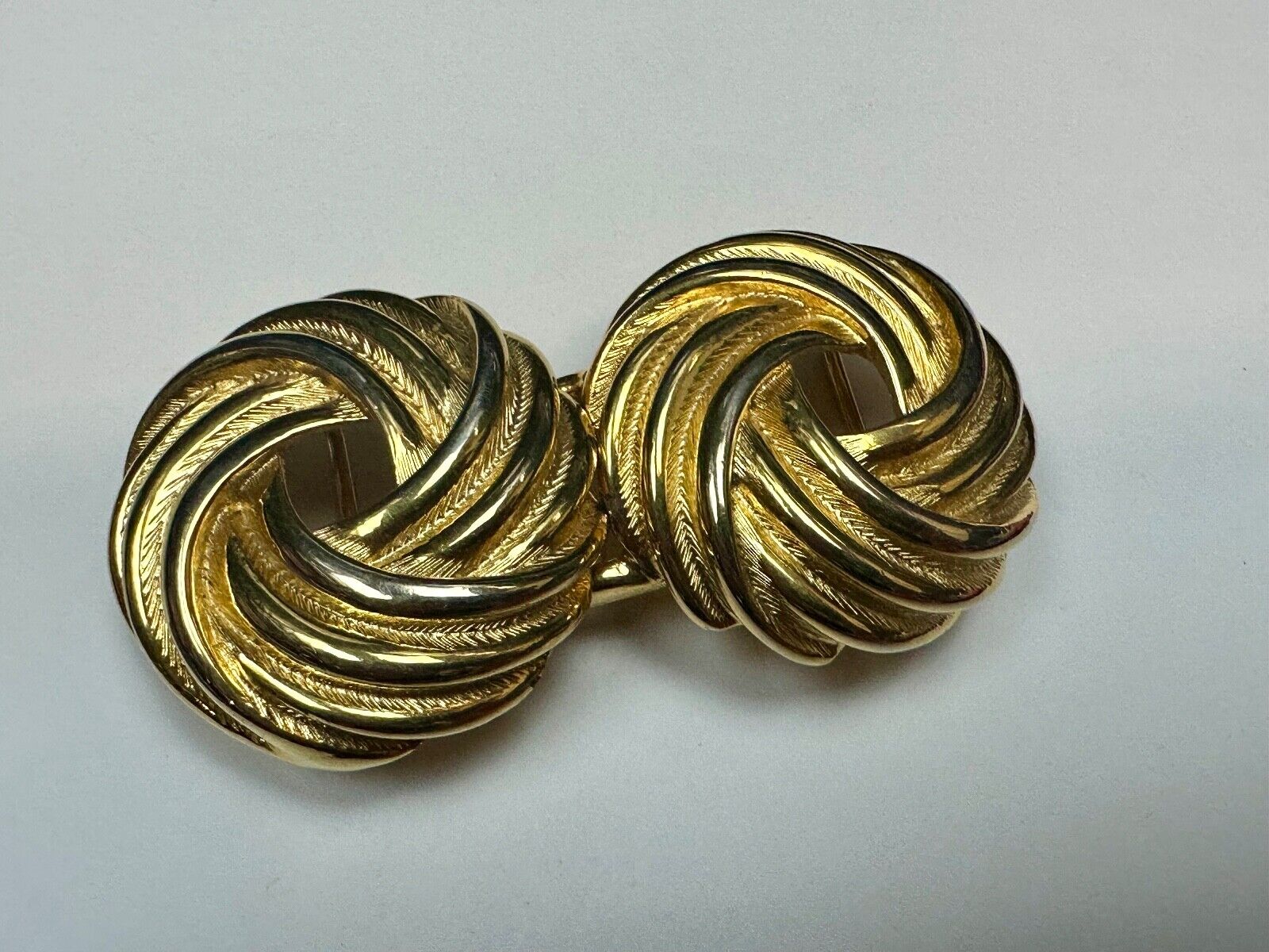 Two piece Round Swirl Interlocking gold color belt buckle by Douglas Paquette