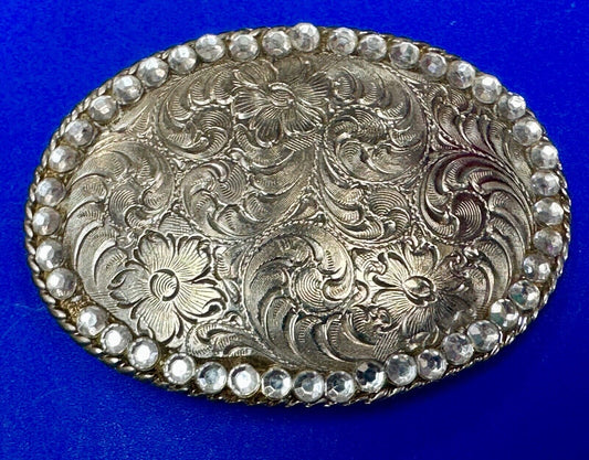 vintage 1996 western flower swirl oval belt buckle with rhinestone boarder