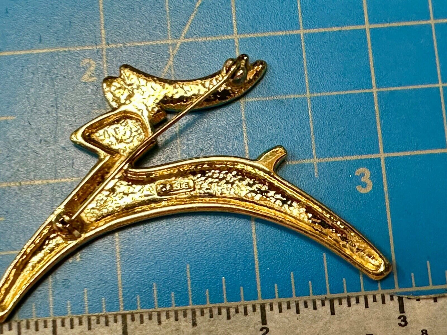 Abstract gold tone running deer - Vintage Christmas Holliday Brooch by AJC