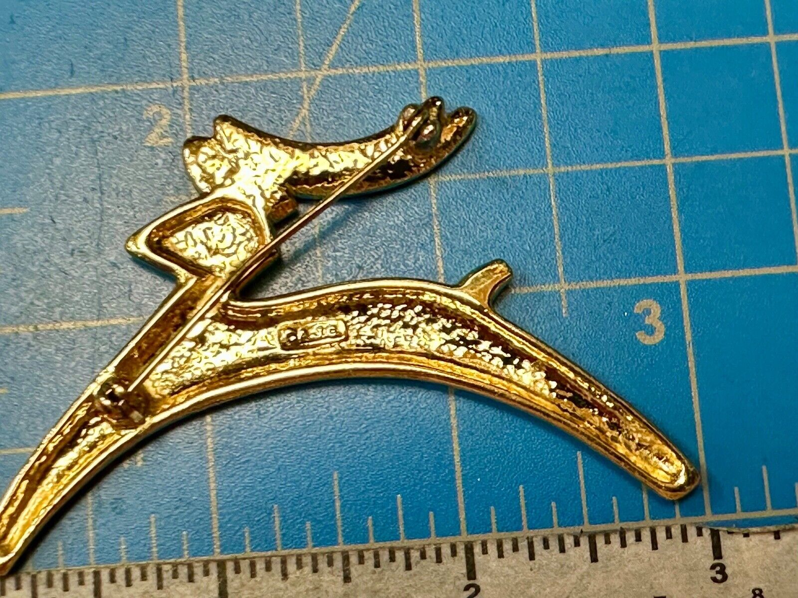Abstract gold tone running deer - Vintage Christmas Holliday Brooch by AJC