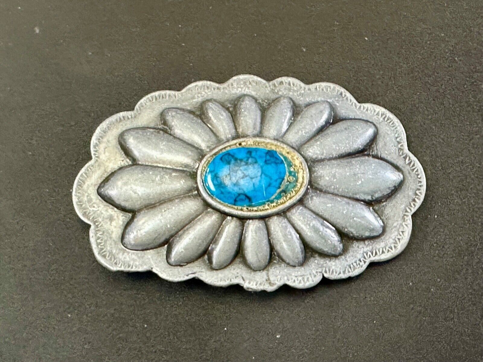 Turquoise stone centered on Vintage metal flower theme belt buckle