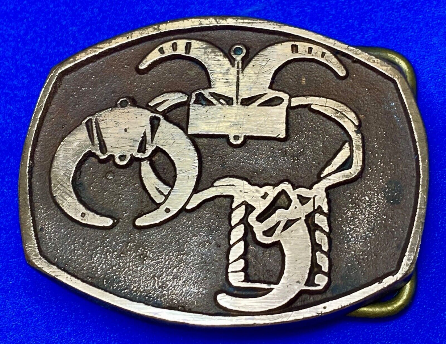 unknown to me - cattle branding symbols? longhorn western? belt buckle