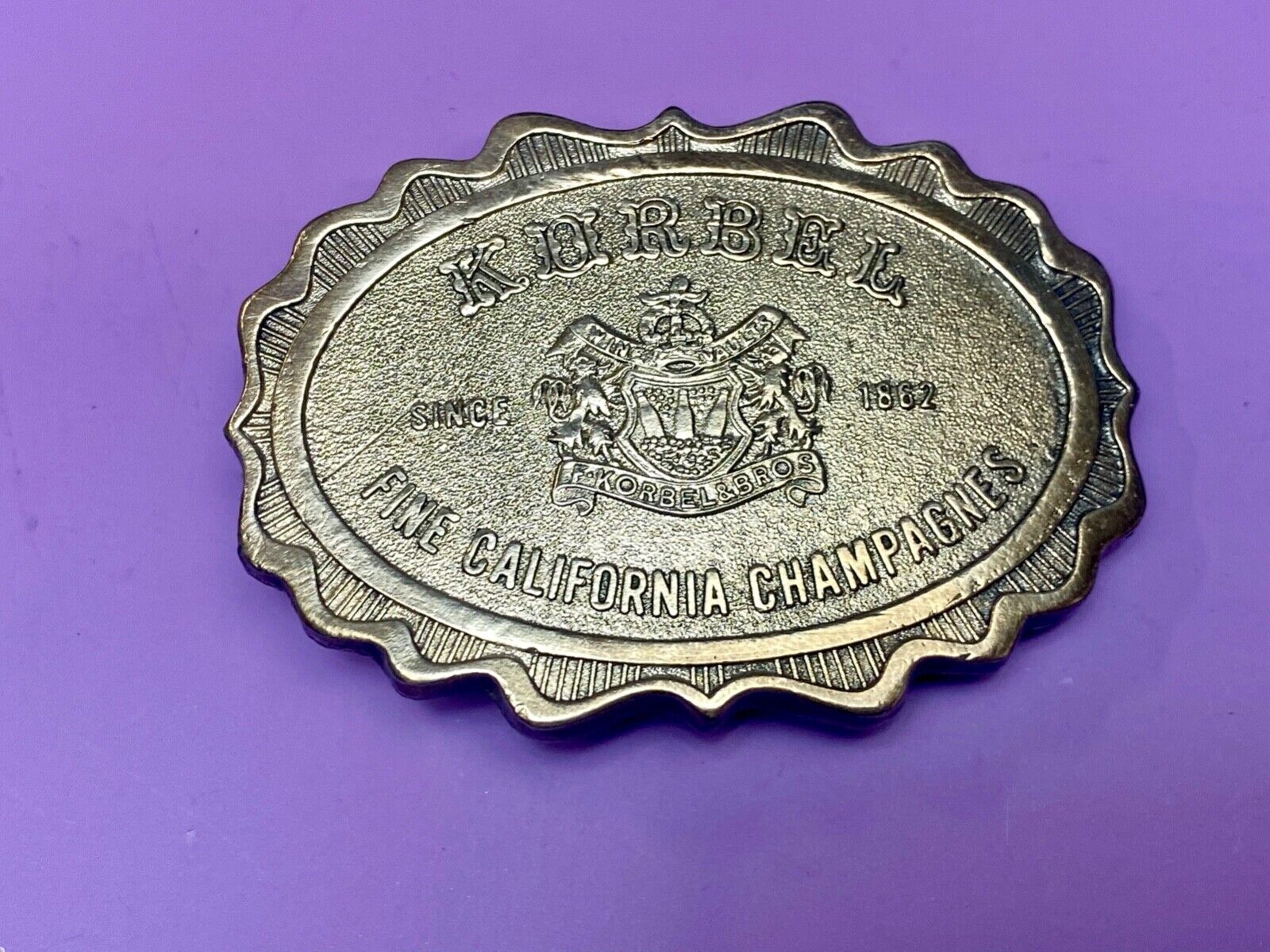 vintage Korbel Fine California champagne belt buckle by Wyoming Studio Art